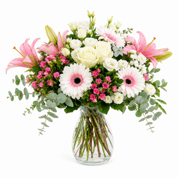 Ramo Milos con lirios rosados, rosas blancas, gerberas y verdes naturales. Envío de ramos de flores a domicilio.